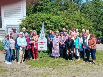 Members and Friends of the Edgecomb Community Church stand by the new capital campaign sign which will record the progress of their fundraising efforts. Courtesy photo
