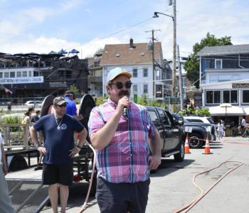 Michael Maxim emcees the WJD Tug of War Across the Harbor June 27. LISA KRISTOFF/Boothbay Register
