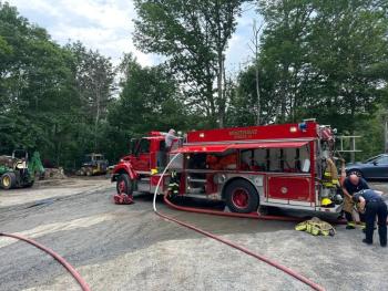Firefighters at the scene of the fire at 7 Farnham Point Road, East Boothbay, June 30. Mark Sullivan photo