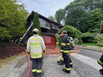 Firefighters at the scene of the fire at 7 Farnham Point Road, East Boothbay, June 30. Mark Sullivan photo