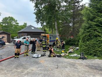 Firefighters at the scene of the fire at 7 Farnham Point Road, East Boothbay, June 30. Mark Sullivan photo