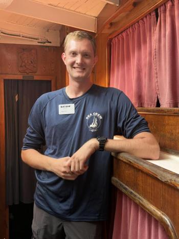 Considering his time aboard Corwith Cramer a formative undergraduate experience, Nathan Miller now helps shape memories as a deckhand.   ISABELLE CURTIS/Boothbay Register