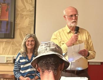 Jerry Homer introduces Mary Lou Teel, seated. EMMA BENVENUTO/Boothbay Register