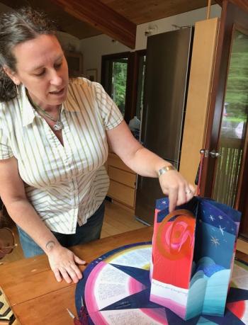 Book artist Joelle Webber displays one of her artist books. During Wiscasset Art Walk drop by her sidewalk paper flower workshop. Free materials provided. Photo courtesy of the artist