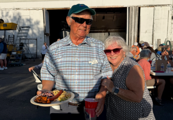 A little Boothbay history at the DEYC Haul Out Party: longtime DEYC members Brenda Blake and Frank Luke, friends and Boothbay Region High School class of 1963, share a moment at Luke’s Boatyard on Linekin Bay. Courtesy of Jeanne Koenig