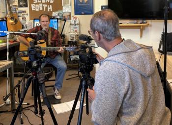 BRTV cameraman Robert Jordon sets up the shot for Chip Schwehm's performance on the station's newest show, "The Sound Booth."  ISABELLE CURTIS/Boothbay Register