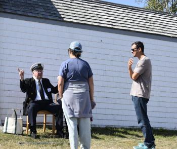 The knowledgeable and entertaining Howard Wright with Burnt Island visitors. LISA KRISTOFF/Boothbay Register