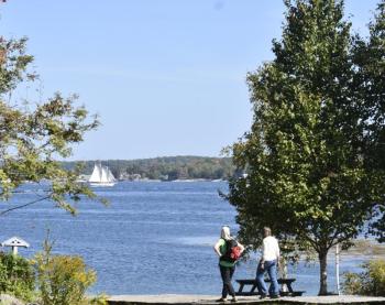 A couple visitors heading for the beach. LISA KRISTOFF/Boothbay Register