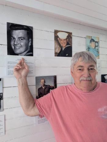 Steve points to the photo of his father James McCullough, Burnt Island lighthouse keeper from 1958-1961. Nancy McCullough photo