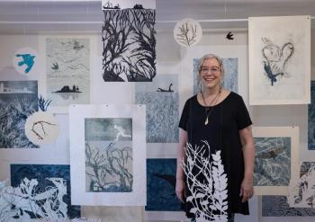 Suzanne Stokes with her installation of monoprints. Courtesy of SML