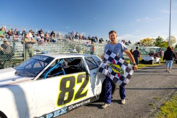 Chaz Briggs with the checkered flag. Jasen Dickey photo