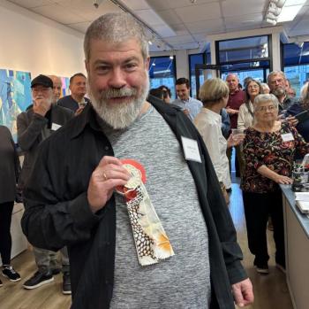 Charlie Nowell shows off his Honorable Mention ribbon for "Birds of Paradise." LISA KRISTOFF/Boothbay Register