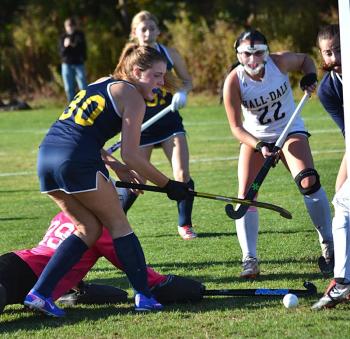 Olivia Hardwick, with the Hall-Dale goalie on the ground, pushes the ball into the open goal to give Boothbay a 2-1 lead in the second quarter of Thursday's game at home. KEVIN BURNHAM/Boothbay Register