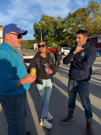 Business owners Dave Bean, left, talks with Kristin and Nick Page at the party. Courtesy photo
