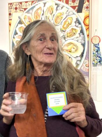 Artist Georjean Machulis, the People's Choice for her mixed media, "Divine Mother." LISA KRISTOFF/Boothbay Register