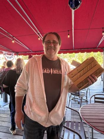 Peter Donovan after buying a box set.   LISA KRISTOFF/Boothbay Register