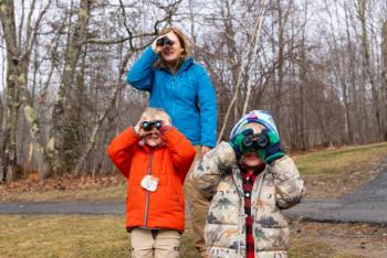 Boothbay Region Elementary School students practice bird watching with Tracey Hall, environmental educator from the Boothbay Region Land Trust. Photo by Brass Duck Photography/Used with permission