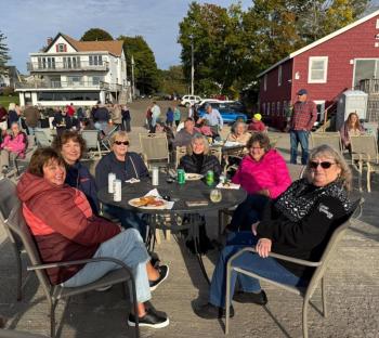 Enjoying the food and conversations at the party. Courtesy photo