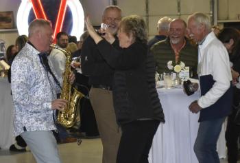 Saxophonist Darren Whitney and some appreciative attendees. LISA KRISTOFF/Boothbay Register
