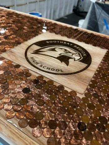 Boothbay Region High School Seahawks insignia in the penny bar. Courtesy of Jennie Plummer