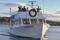 Santa and his entourage arriving by boat to Whale Park Dec. 7. FRITZ FREUDENBERGER/Boothbay Register