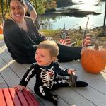 A child, a woman and a pumpkin