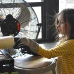 BRES first graders try their hand at reshaping recycled plastic with artist Kim Bernard's extruder. ISABELLE CURTIS/Boothbay Register