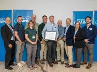 Evergreen Home Performance team with Efficiency Maine staff at 2025 awards ceremony for top insulation rebate contractor in Maine