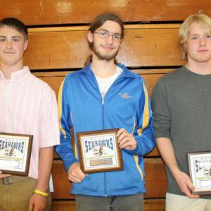 Boys tennis plaque winners, from left, Collin Thompson, Sam Schwehm and Brady Duncan