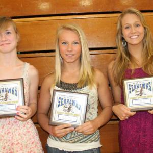 Girls track plaque winners, from left, Sinead Miller, Morgan Crocker and Alexandra Andrews