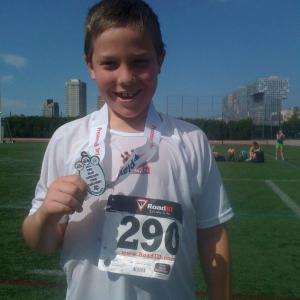 Adam is all smiles after receiving his medal.