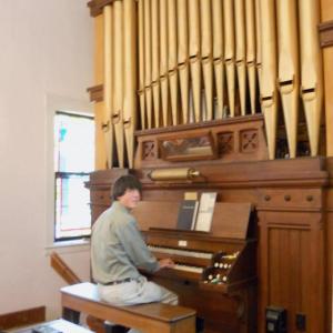 Mitch Boucher practices at the organ for his performance for the Champagne of the Sheepscot. Courtesy of Sheepscot Valley Conservation Association Mitch Boucher practices at the organ for his performance for the Champagne of the Sheepscot. Courtesy of Sheepscot Valley Conservation Association