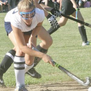 Senior Co-Captain Sarah Caron keeps her eyes on the ball as she tries to pass to a teammate during Wednesday's home and season opener against St. Dom's. Below, Tori Schmid, a junior on the Lady Seahawks field hockey team, dribbles the ball up-field. KEVIN BURNHAM/Boothbay Register Senior Co-Captain Sarah Caron keeps her eyes on the ball as she tries to pass to a teammate during Wednesday's home and season opener against St. Dom's. KEVIN BURNHAM/Boothbay Register