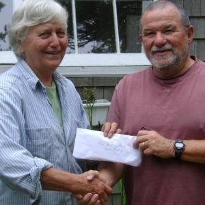 John Webster, proprietor of Orne’s Candy Store, gives $400 to Betsy Wing, treasurer of the Boothbay Region Food Pantry. John Webster, proprietor of Orne’s Candy Store, gives $400 to Betsy Wing, treasurer of the Boothbay Region Food Pantry.