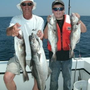 Bob Damrell of Georgetown and Aaron Willoughby display their catches. Courtesy of Barry Gibson Bob Damrell, Aaron Willoughby, Boothbay, Boothbay Harbor