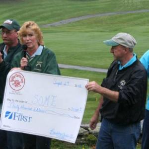 Brenda Blackman presents a check to Special Olympics Maine at the Boothbay Charities Classic Open in 2008. Courtesy of the Boothbay Charities Classic committee