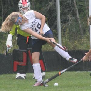 Samantha Carter clears the ball in front of goalie Madison McCarthy during Friday's game at home against Lisbon. KEVIN BURNHAM/Boothbay Register
