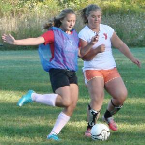 Anna Baumm (left) and Brenna Alley vie for the ball during a scrimmage at the August 30 team practice. LISA KRISTOFF/Boothbay Register 