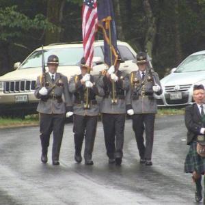 Bagpiper Donald Duncan leads Commander Bruce Stockford and the Honor Guard, commemorating those who have fallen in the last 22 years of the event's history. Among the most recent were Ben Davidson, Tom Keating and Jack Gibbons, all long-time supporters of the Boothbay Charities Classic. Courtesy of Jonne Trees/BRCTV Channel 7