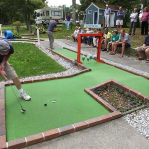 Elmer Lawson shoots for a birdie on the 15th hole in front of  a crowd of onlookers. RYAN LEIGHTON/Boothbay Register