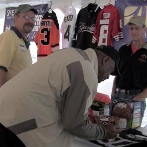 autographs a jersey with auction organizers Tom Erskine and Bob Umberfield during the sports auction at the Boothbay Railway Village. The auction raised $18,000 for Special Olympics Maine. Courtesy of Jonne Trees/BRCTV Channel 7 autographs a jersey with auction organizers Tom Erskine and Bob Umberfield during the sports auction at the Boothbay Railway Village. The auction raised $18,000 for Special Olympics Maine. Courtesy of Jonne Trees/BRCTV Channel 7