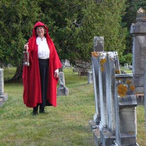 Sally Lobkowicz, director of Red Cloak Haunted History Tours, explores a cemetery. The popular walking tours, which have included five Mid Coast Maine towns for the past seven years, is opening a new option for their guests Red Cloak Cemetery Tours. Sally Lobkowicz, director of Red Cloak Haunted History Tours, explores a cemetery. The popular walking tours, which have included five Mid Coast Maine towns for the past seven years, is opening a new option for their guests Red Cloak Cemetery Tours.