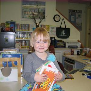 Audrey gathers some carefully selected books to read until she returns for Story Time next week. Audrey gathers some carefully selected books to read until she returns for Story Time next week.