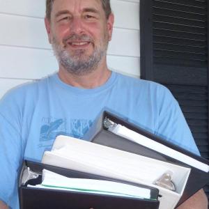 Sheepscot Valley Conservation Association board member Paul Hoffman holds a portion of the submissions required for the Land Trust Accreditation. Courtesy of Sheepscot Valley Conservation Association Sheepscot Valley Conservation Association board member Paul Hoffman holds a portion of the submissions required for the Land Trust Accreditation. Courtesy of Sheepscot Valley Conservation Association