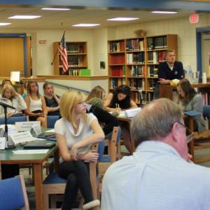 Debaters and the audience, including Principal Dan Welch, listen intently to opening remarks on October 26. SUE MELLO/Boothbay Register