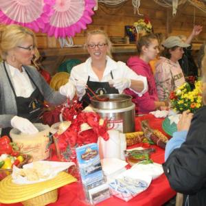 Kelly Flynn, left, and Holly Stover dish out Brown's Wharf first-place chili, made by Micah Jones