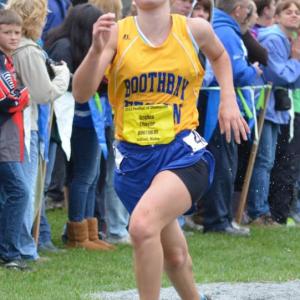 Sophia Thayer charges in at the end of girls' seeded race. Thayer placed nineteenth out 239 runners with a time of 21:22. Courtesy of Aquilino Alamo