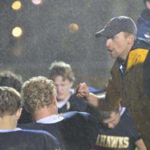 Coach Bryan Dionne delivers a post game speech to the Seahawks squad under the rainy Friday night loss to Telstar. Killian Miller, below, has reason to smile at a season that saw much improvement, and Blocker Linc Simmons fends off a Telstar defender as Runningback Jason Maddocks makes a rushing attempt. Courtesy of Aquilino Alamo Coach Bryan Dionne delivers a post game speech to the Seahawks squad under the rainy Friday night loss to Telstar. Courtesy of Aquilino Alamo