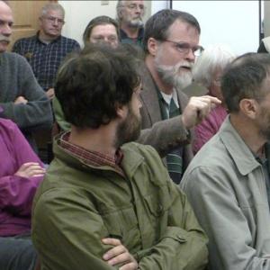 Paul Baines, a Planning Board member, from Bowdoinham, center, vouches for his friend, David Stimson, front right, during Monday's selectmen meeting in Boothbay. The meeting drew many people who support Stimson Marine. Courtesy of Jonne Trees Paul Baines, a Planning Board member, from Bowdoinham, center, vouches for his friend, David Stimson, front right, during Monday's selectmen meeting in Boothbay. The meeting drew many people who support Stimson Marine. Courtesy of Jonne Trees