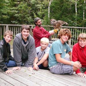 Troop 238 visited Birdsacre Sanctuary in Ellsworth. Pictured from left are, front: Parker Elkins; Jacob Bishopp; Draco Peaslee; Sherman Brewer; Jake Brewer; back: birdhandler Grayson with a resident owl. Below, Jacob Bishopp learns how to hold a wood duck on his birthday. Courtesy of Sarah Sherman Troop 238 visited Birdsacre Sanctuary in Ellsworth. Pictured from left are, front: Parker Elkins; Jacob Bishopp; Draco Peaslee; Sherman Brewer; Jake Brewer; back: birdhandler Grayson with a resident owl. Courtesy of Sarah Sherman